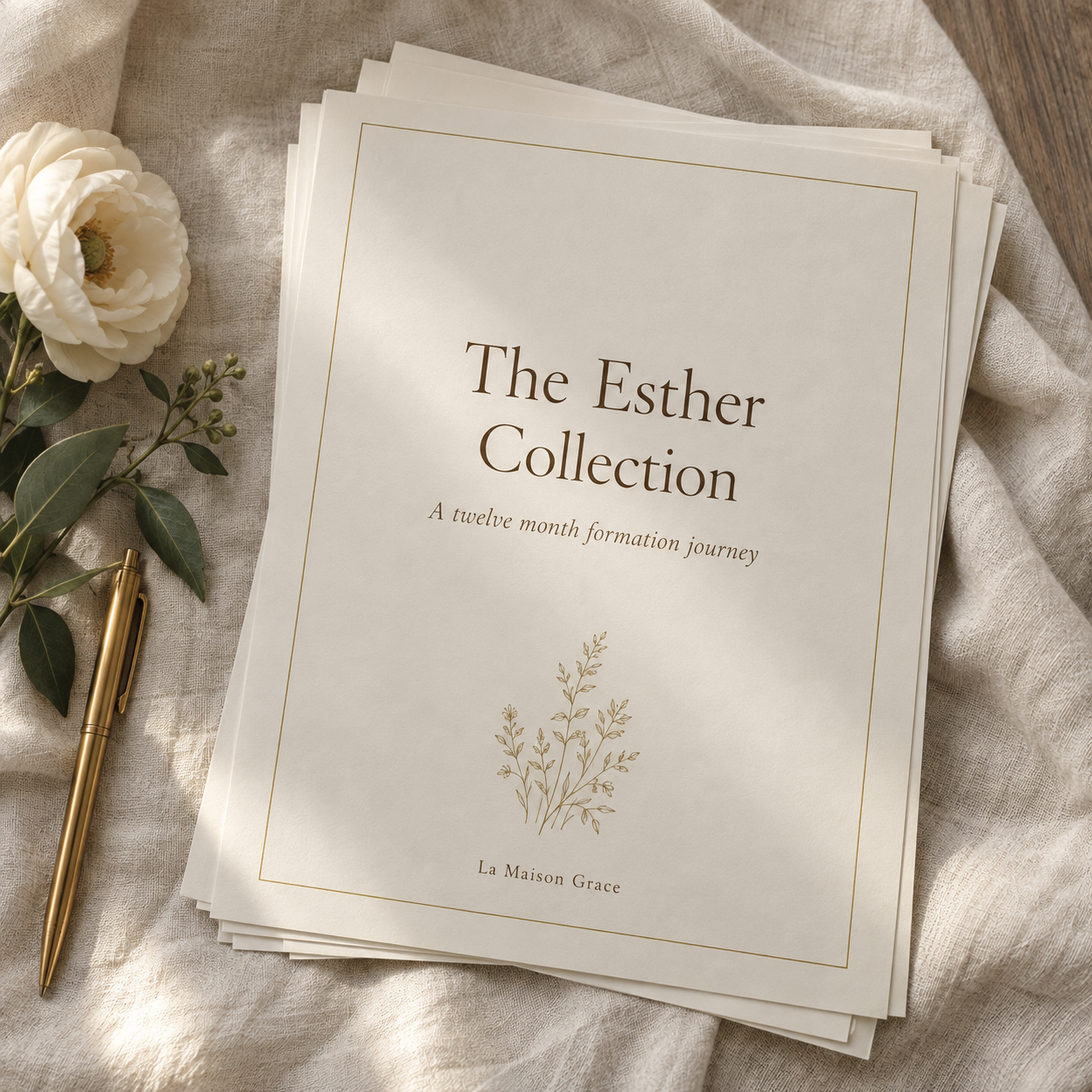 The Esther Collection printable pages on ivory linen beside a white flower and gold pen.